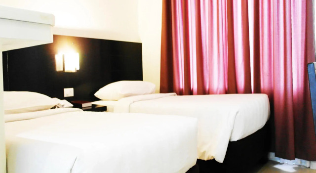Manhattan Suites Inn, Забронировать Отель Думагете Negros Oriental, рядом с Бульвар Рисаль