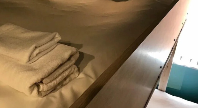 Кровать в общем номере с 6 комнатами WELLSTAY Osaka Shinsaibashi Apartment hotel