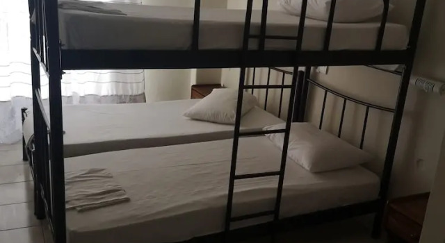 Кровать в общем номере Elite Hotel