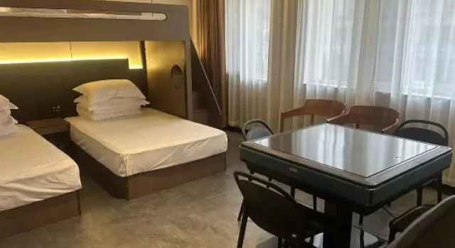 Łóżko w pokoju wieloosobowym Buddy Hotel