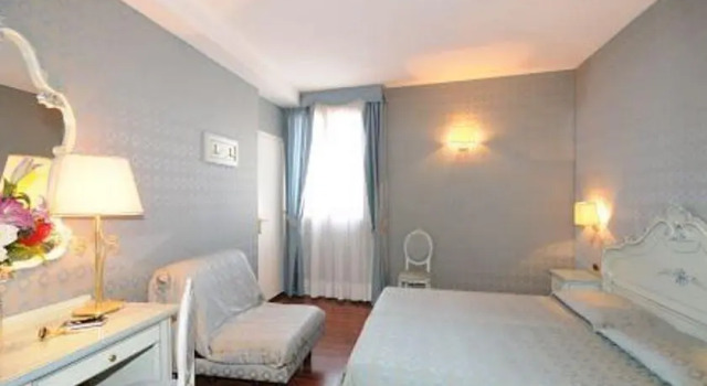 Кровать в общем номере Locanda Antica Venezia