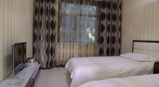 Ancient City Dragon Gate Inn, Book Hotel Jiuquan Gansu