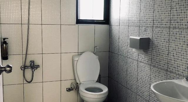 Кровать в общем номере Blue Ocean SCUBA Homestay