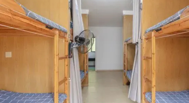 Кровать в общем номере Xidi Huaxipan YouthHostel