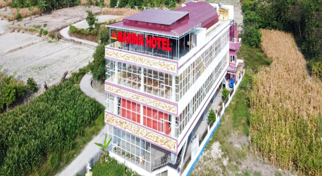 OYO 3215 Marina Hotel, Rezerwuj Hotel Sialanguan Pangururan