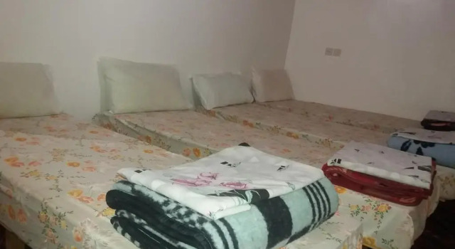 Кровать в общем номере Gîte Assafar