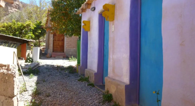 Кровать в общем номере Casa Colores