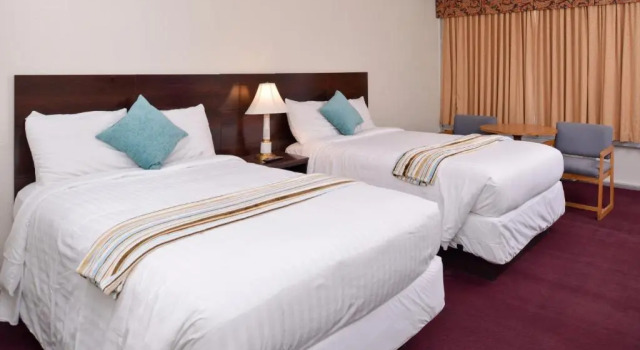 Четырёхместный номер Deluxe Red Carpet Inn Battleboro