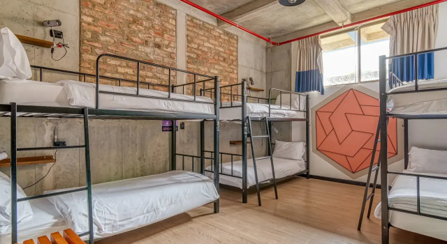 Кровать в общем номере Delgadillo Boutique Hotel by Socialtel