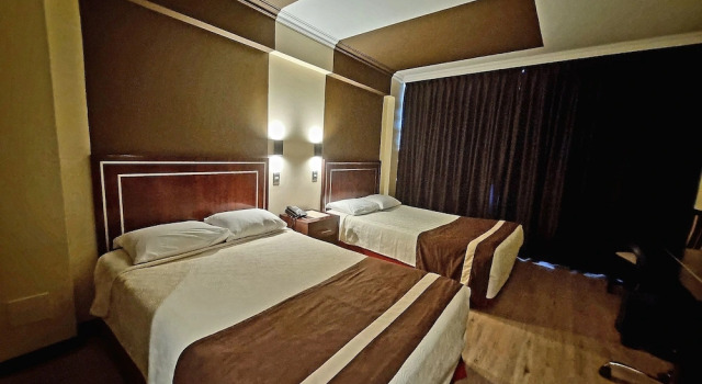 Кровать в общем номере Hotel El Araucano