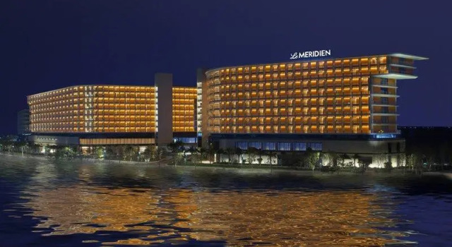 Кровать в общем номере Le Méridien Xiaojing Bay