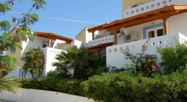 Кровать в общем номере Castri Village Hotel