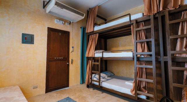 Кровать в общем номере The Shack Hideaway by Mayumi Resorts