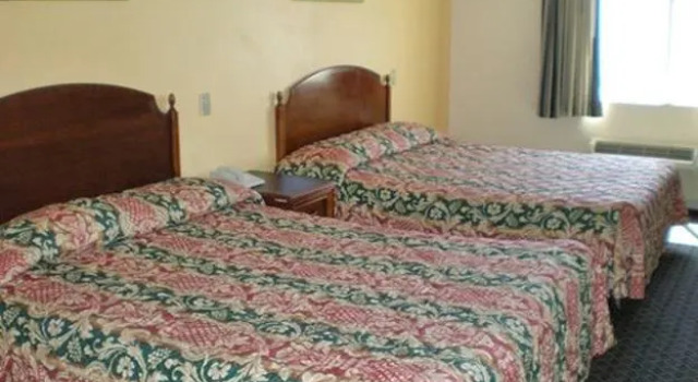 Четырёхместный люкс Deluxe Passport Inn & Suites Corona Hotel