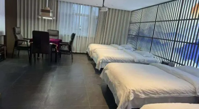 Кровать в общем номере Dehui Qiantang Elegant Restaurant Business Hotel