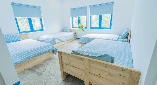 Кровать в общем номере с балконом SANTORI Hoi An Homestay