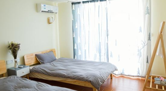 Кровать в общем номере с 4 комнатами Hengda Miaoleiwu Elegant Holiday Villa