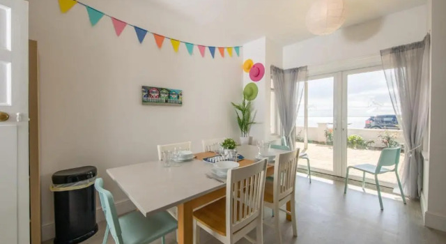 Коттедж Absolute Beachfront With Decked Garden Oasis and Views