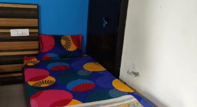 Кровать в общем номере Goroomgo Naturevilla Cafe & Homestay Rishikesh