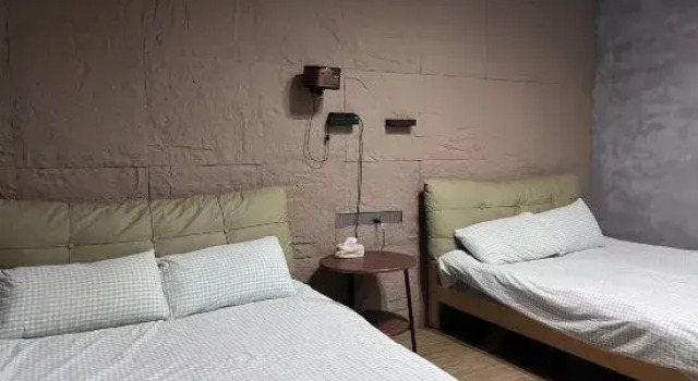 Cama en dormitorio compartido PingTan Suse