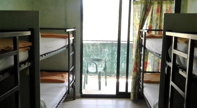 Cama em dormitório chez marie