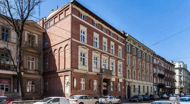 Кровать в общем номере Hotel Maksymilian