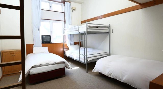 Кровать в общем номере Hakuba Gondola Hotel