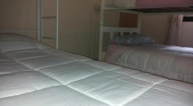 Łóżko w pokoju wieloosobowym Costas Hostel Action