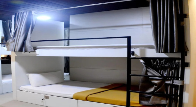 Кровать в общем номере Hotel Prasad NX