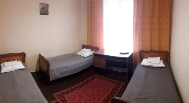 Кровать в общем номере Kolos Hotel Obolon