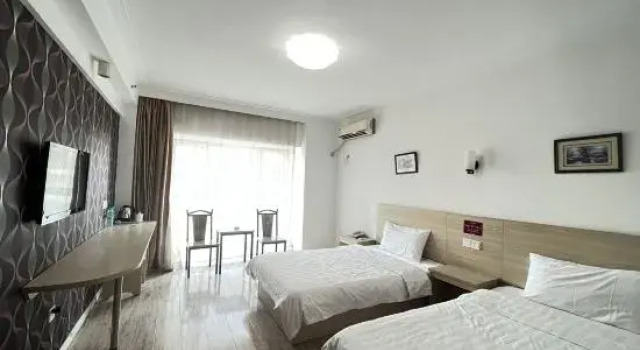 Кровать в общем номере Shenyang Pangjiang Hotel