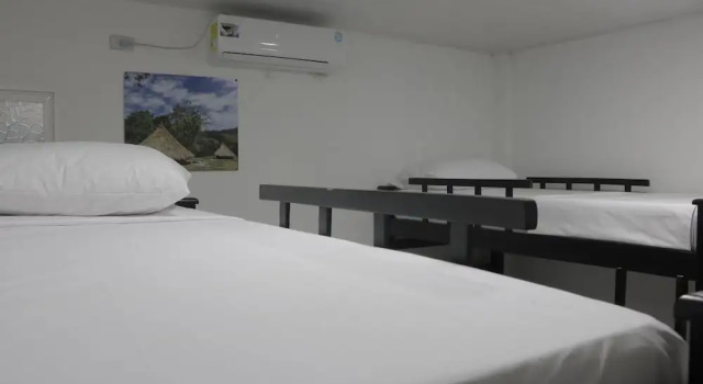 Кровать в общем номере Puerto Caribe Hostal