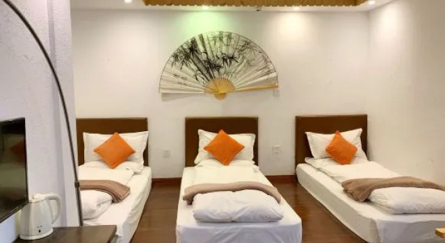 Кровать в общем номере Hangzhou Sweetolive Yododo Inn
