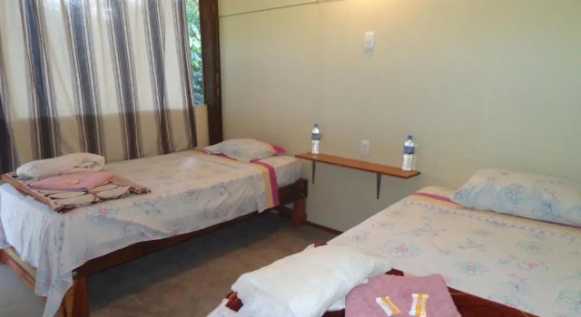 Кровать в общем номере Passiflora Lodge Tambopata