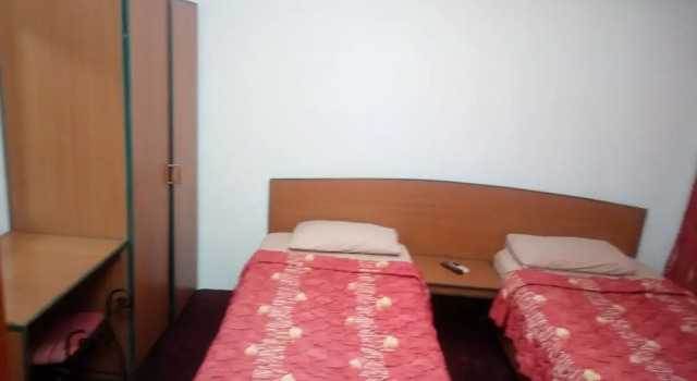 Кровать в общем номере с видом на город Invitation Hotel