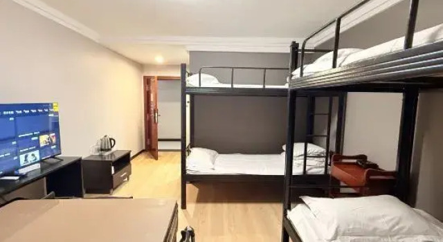 Кровать в общем номере Xiaojia Biyu Business Hotel