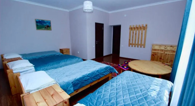 Кровать в общем номере Muras Hotel Karakol (Мурас Каракол)