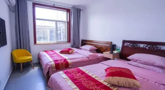 Кровать в общем номере Beijing Haolaijujusu