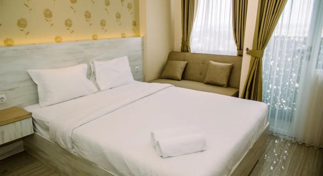 Апартаменты Simple And Cozy Studio Apartment At Urban Heights Residences