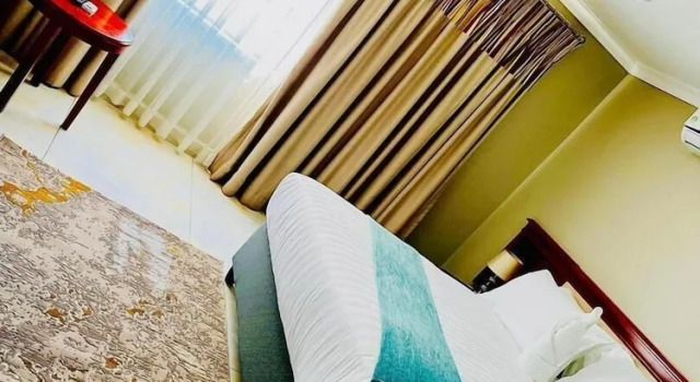 Bett im Wohnheim Rosenia Boutique Hotel
