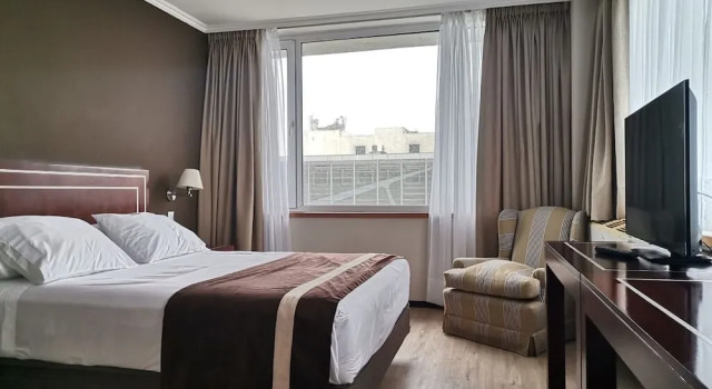 Кровать в общем номере Hotel El Araucano