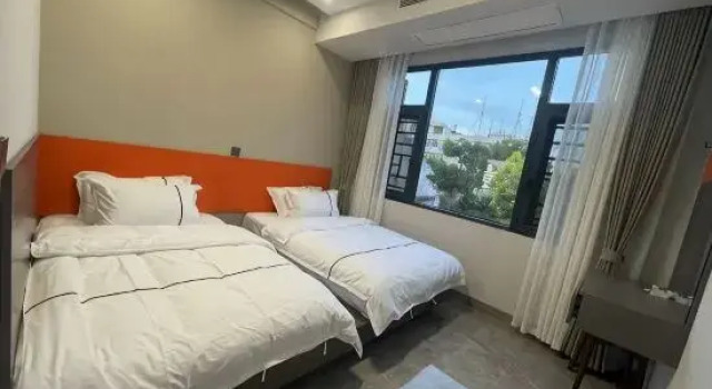 Кровать в общем номере Caiman Homestay