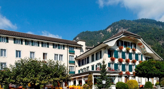 Кровать в общем номере Hotel Beausite