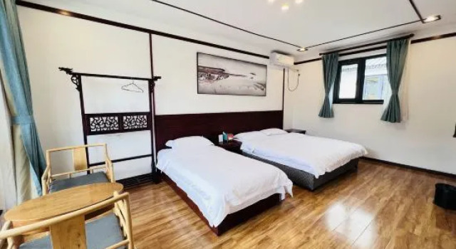 Кровать в общем номере Qianyuan Leisure Resort