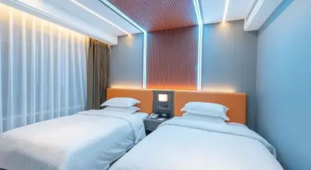 Кровать в общем номере hengyangHuayunli Hotel (East Gate of Nanhua University)