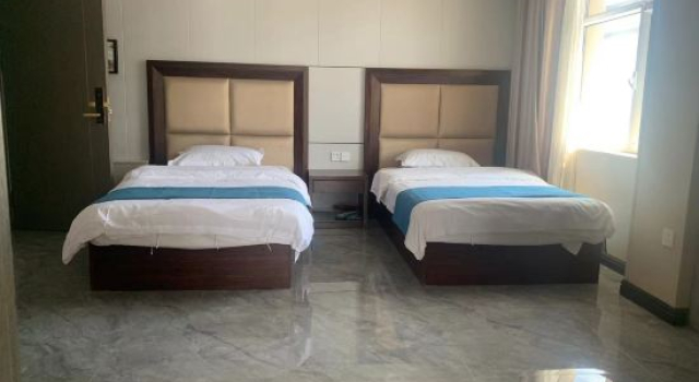 Люкс Deluxe Wanjuxing Hotel in Xiwu Banne