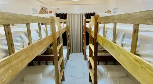 Кровать в общем номере Casa Vina El Nido
