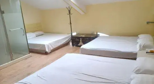 Кровать в общем номере Wafangdian Guanxinchao Hotel