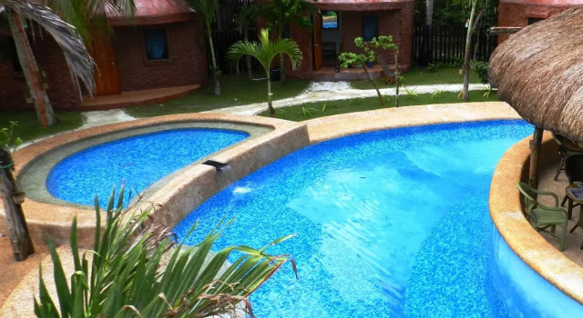 Кровать в общем номере Panglao Chocolate Hills Resort
