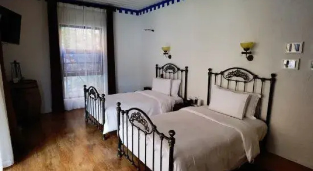 Кровать в общем номере с видом на море Baima Holiday Qingshe Seaview Manor